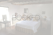 Rosina queen bedroom with the word BOOKED