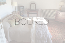 Rosina king bedroom with the word BOOKED